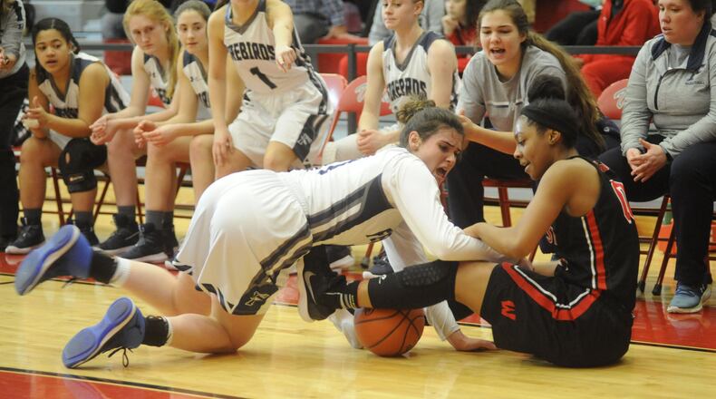 Mali Morgan-Elliott of Fairmont (left) battles Jaydis Gales. Lakota West defeated Fairmont 53-29 in a girls high school basketball D-I district final at Princeton on Sat., March 3, 2018. MARC PENDLETON / STAFF