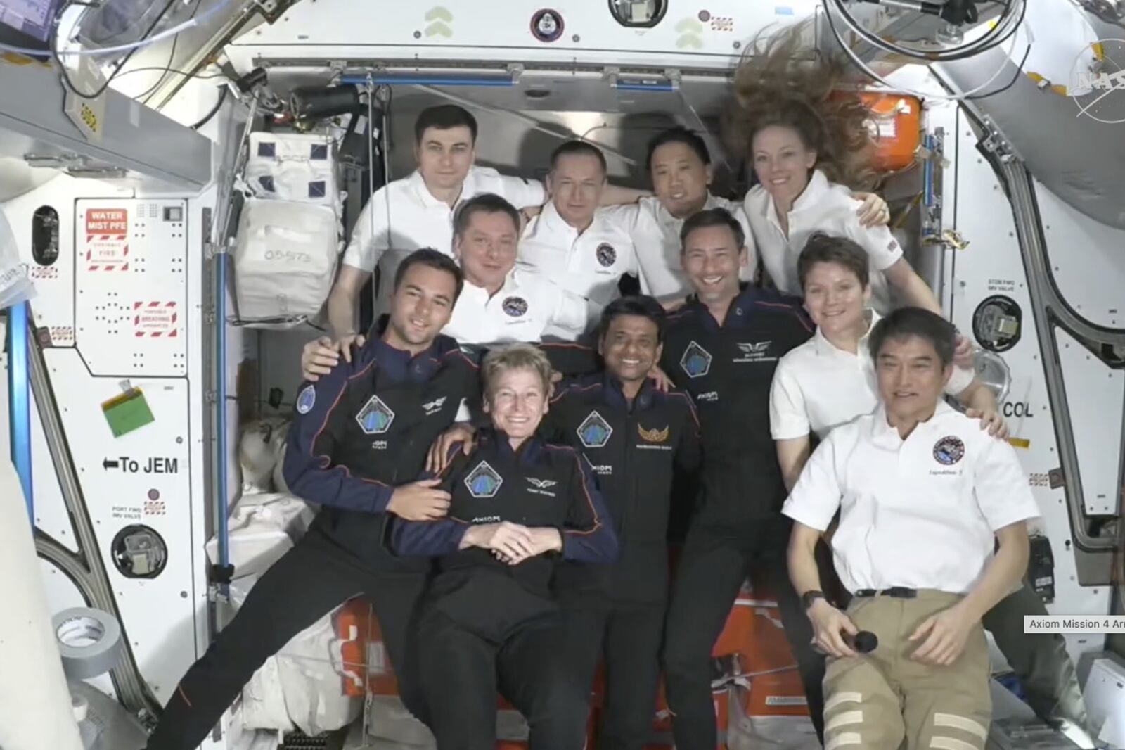 This image provided by NASA shows visiting crew in dark blue, Hungary's Tibor Kapu, left, Axiom Space's Peggy Whitson, center left, India's Shubhanshu Shukla, center right, and Poland's Slawosz Uznanski-Wisniewski aboard the International Space Station, Thursday June 26, 2025. (NASA via AP)