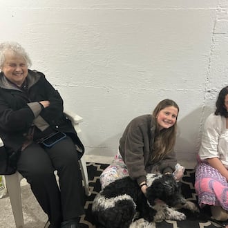 Dayton Daily News Writer Meredith Moss, left, is seen in a bomb shelter with two grand-nieces in Jerusalem March 1, 2026. They have been in the shelter about a dozen times since fighting with Iran began two days prior. CONTRIBUTED
