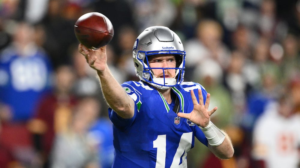 Seattle Seahawks quarterback Sam Darnold (14) passes the ball during the first half of an NFL football game against Washington Commanders, Sunday, Nov. 2, 2025, in Landover, Md. (AP Photo/Nick Wass)