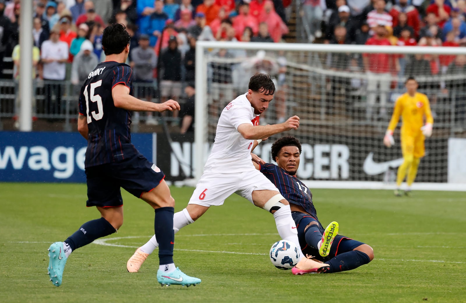Turkey midfielder Orkun Kökçü (6) controls the ball ahead of United States midfielder Malik Tillman (17) as midfielder Johnny Cardoso (15) looks on during the first half of an international friendly soccer game, Saturday, June 7, 2025, in East Hartford, Conn. (AP Photo/Mary Schwalm)