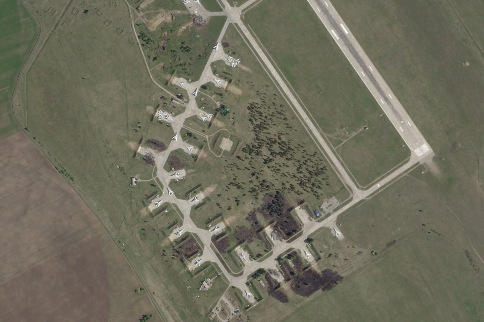 This satellite image from Planet Labs PBC shows damage after a Ukrainian drone attack targeted the Belaya Air Base in the Irkutsk region of eastern Siberia in Russia on Wednesday, June 4, 2025. (Planet Labs PBC via AP)
