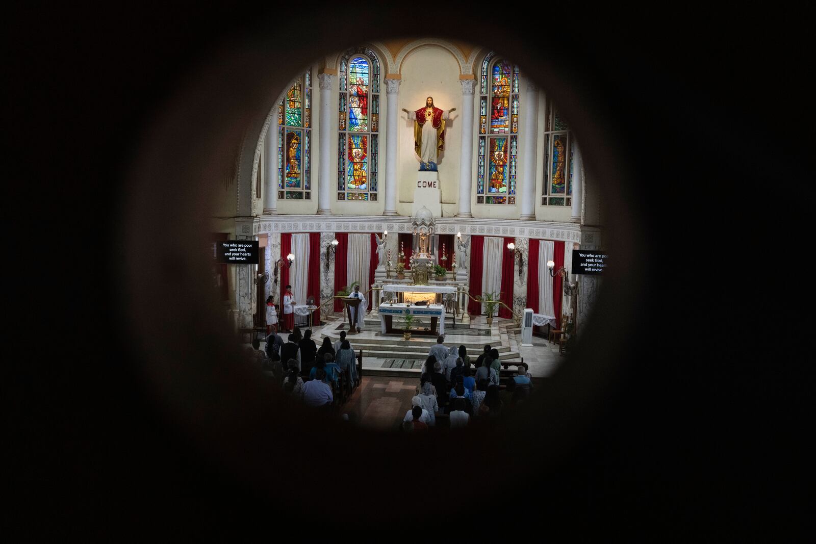 People offer prayers for crew members of the Air India flight that crashed in Ahmedabad last month during a prayer meeting at a church in Mumbai, India, Saturday, July 12, 2025. (AP Photo/ Rafiq Maqbool)