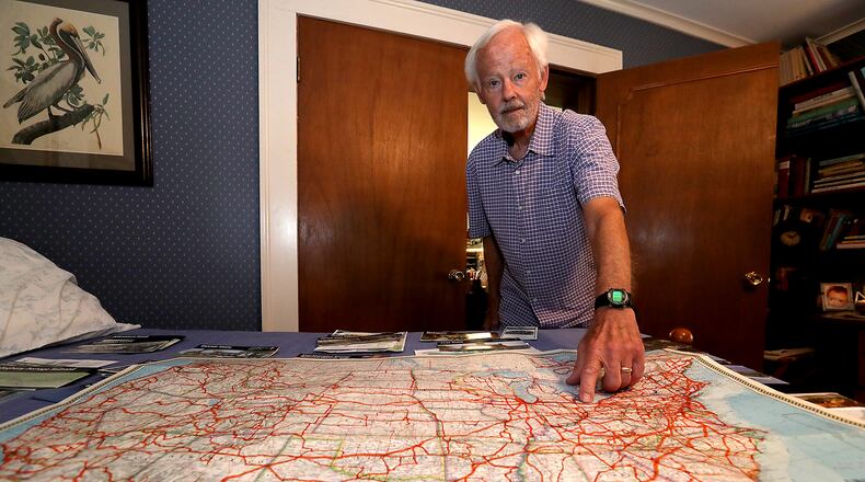 Tom Martin with a map of the United States showing all the roadways he's traveled to get to all the National Parks. BILL LACKEY/STAFF