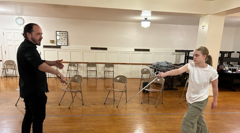 Jaicie Graham, right, rehearses sword fighting with Daniel Morgan for the Showtime Performing Arts production of the Shakespeare classic "Romeo and Juliet" on Friday, Feb. 20 and Saturday, Feb. 21 at the Springfield Metropolis. CONTRIBUTED