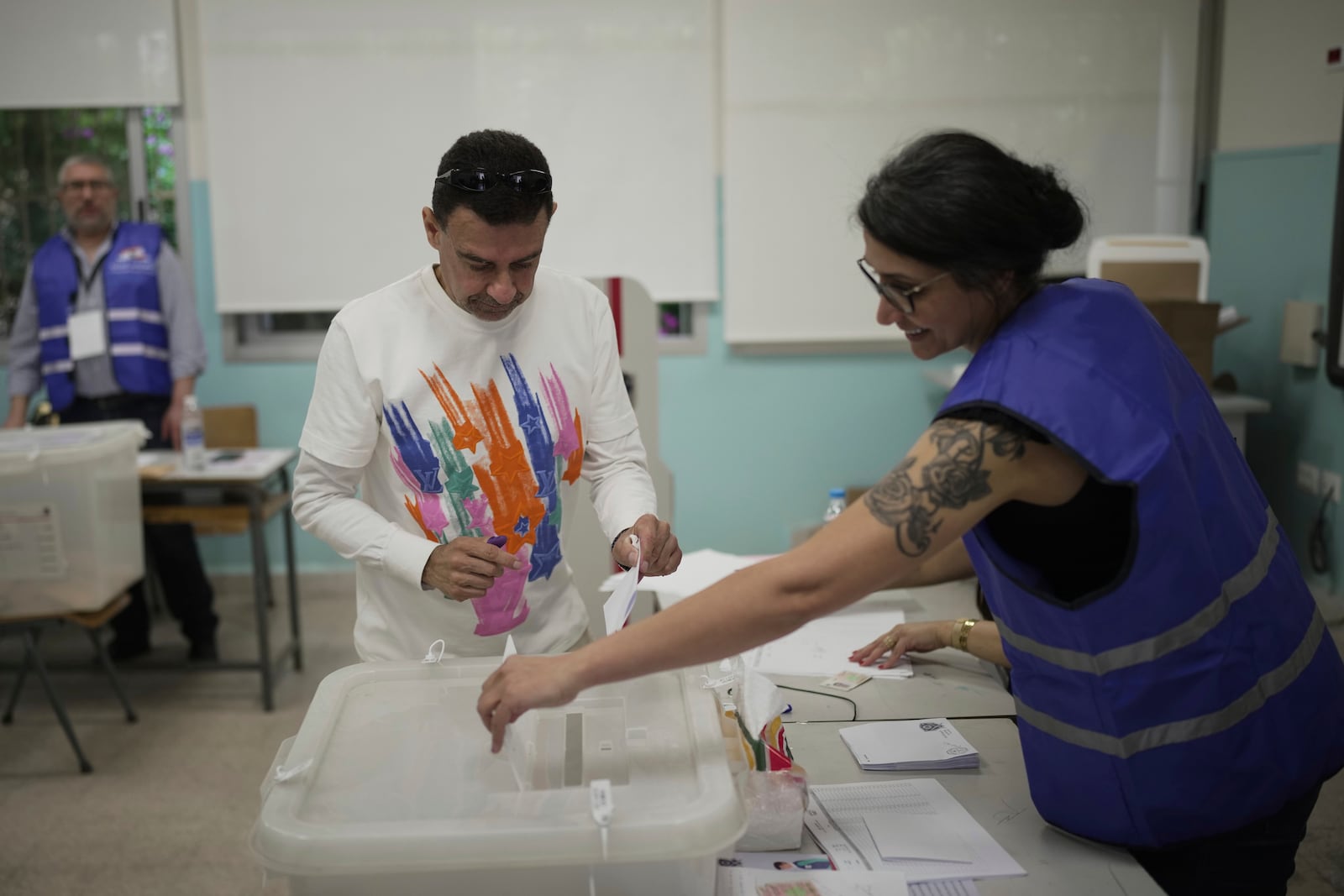 A Lebanese man casts his ballot at a polling station during municipal elections in the southern suburbs of Beirut, Lebanon, Sunday, May 4, 2025. (AP Photo/Hassan Ammar)