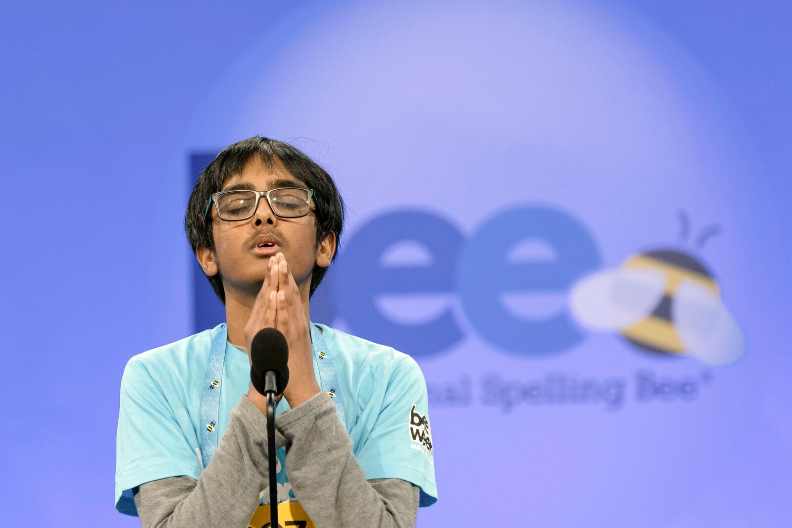 FILE - Faizan Zaki, 12, of Allen, Texas, pauses in the finals of the Scripps National Spelling Bee, in Oxon Hill, Md., May 30, 2024. (AP Photo/Mariam Zuhaib, File)