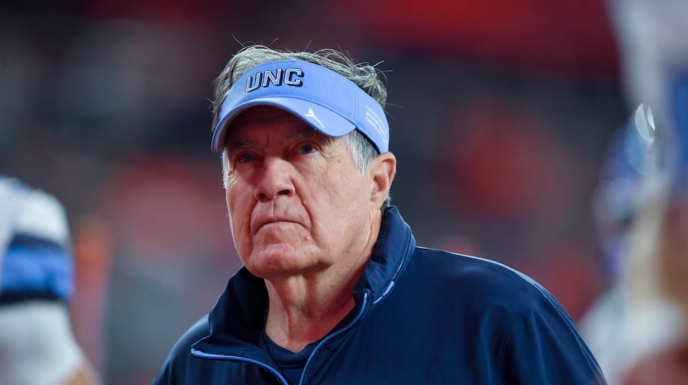 FILE - North Carolina head coach Bill Belichick walks on the field before an NCAA college football game against Syracuse, Oct. 31, 2025, in Syracuse, N.Y. (AP Photo/Adrian Kraus, File)