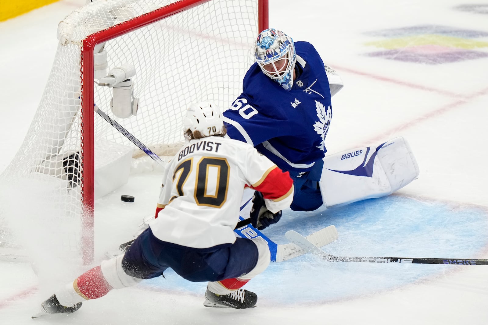 Florida Panthers' Jesper Boqvist (70) scores on Toronto Maple Leafs goaltender Joseph Woll (60) during second period NHL playoff hockey action in Toronto on Wednesday, May 14, 2025. (Frank Gunn/The Canadian Press via AP)