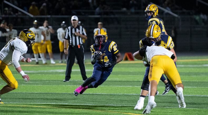 Springfield's Deontre Long runs through a big hole Friday night against Centerville. Logan Howard/CONTRIBUTED