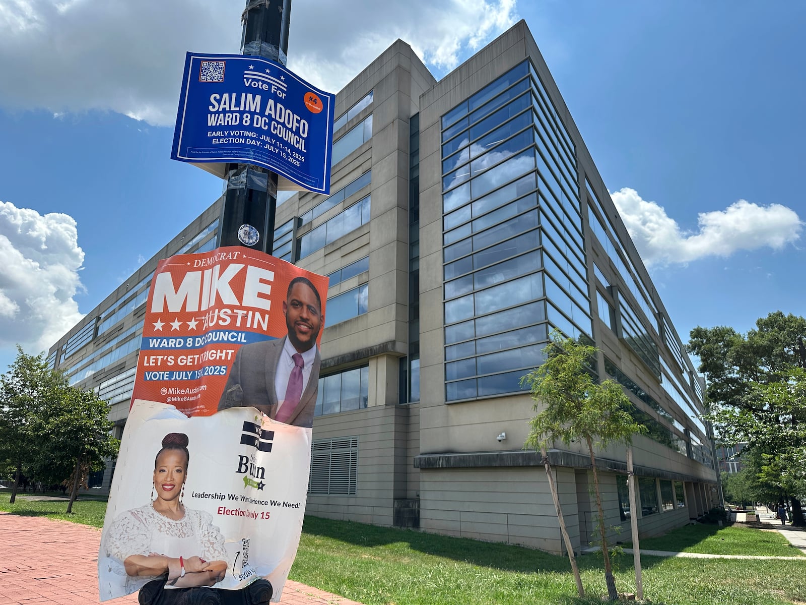 Campaign signs for Ward 8 city council candidates are displayed outside a District of Columbia government building in southeast Washington, Wednesday, July 9, 2025. (AP Photo/Robert Yoon)