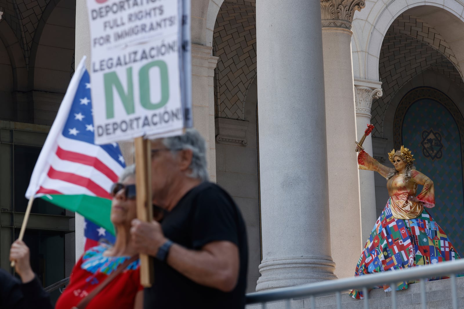Demonstrators take part in a protest against President Donald Trump's policies on Friday, July 4, 2025 in Los Angeles. (AP Photo/Jill Connelly)