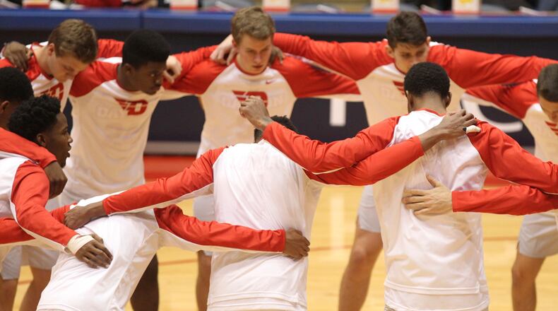 Dayton players huddle before a game against Austin Peay on Friday, Nov. 11, 2016, at UD Arena. David Jablonski/Staff