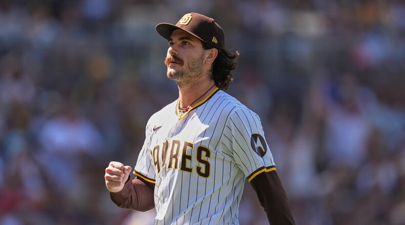 FILE - San Diego Padres starting pitcher Dylan Cease celebrates after the third out during the third inning of a baseball game against the Milwaukee Brewers, Sept. 24, 2025, in San Diego. (AP Photo/Gregory Bull, File)