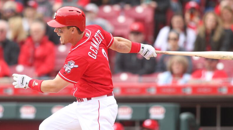 The Reds’ Scooter Gennett swings against the Nationals on Saturday, March 31, 2018, at Great American Ball Park in Cincinnati. David Jablonski/Staff
