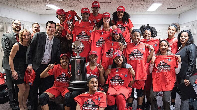 The Ohio State women's basketball team poses in the locker room with the Big Ten championship trophy. (Photo courtesy Ohio State Athletics Communications)