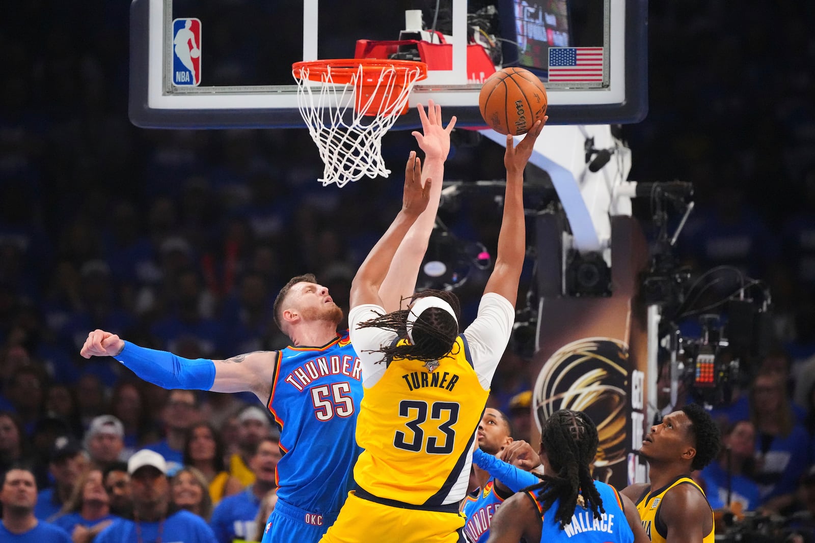 Indiana Pacers center Myles Turner (33) shoots against Oklahoma City Thunder center Isaiah Hartenstein (55) during the first half of Game 2 of the NBA Finals basketball series Sunday, June 8, 2025, in Oklahoma City. (AP Photo/Julio Cortez)