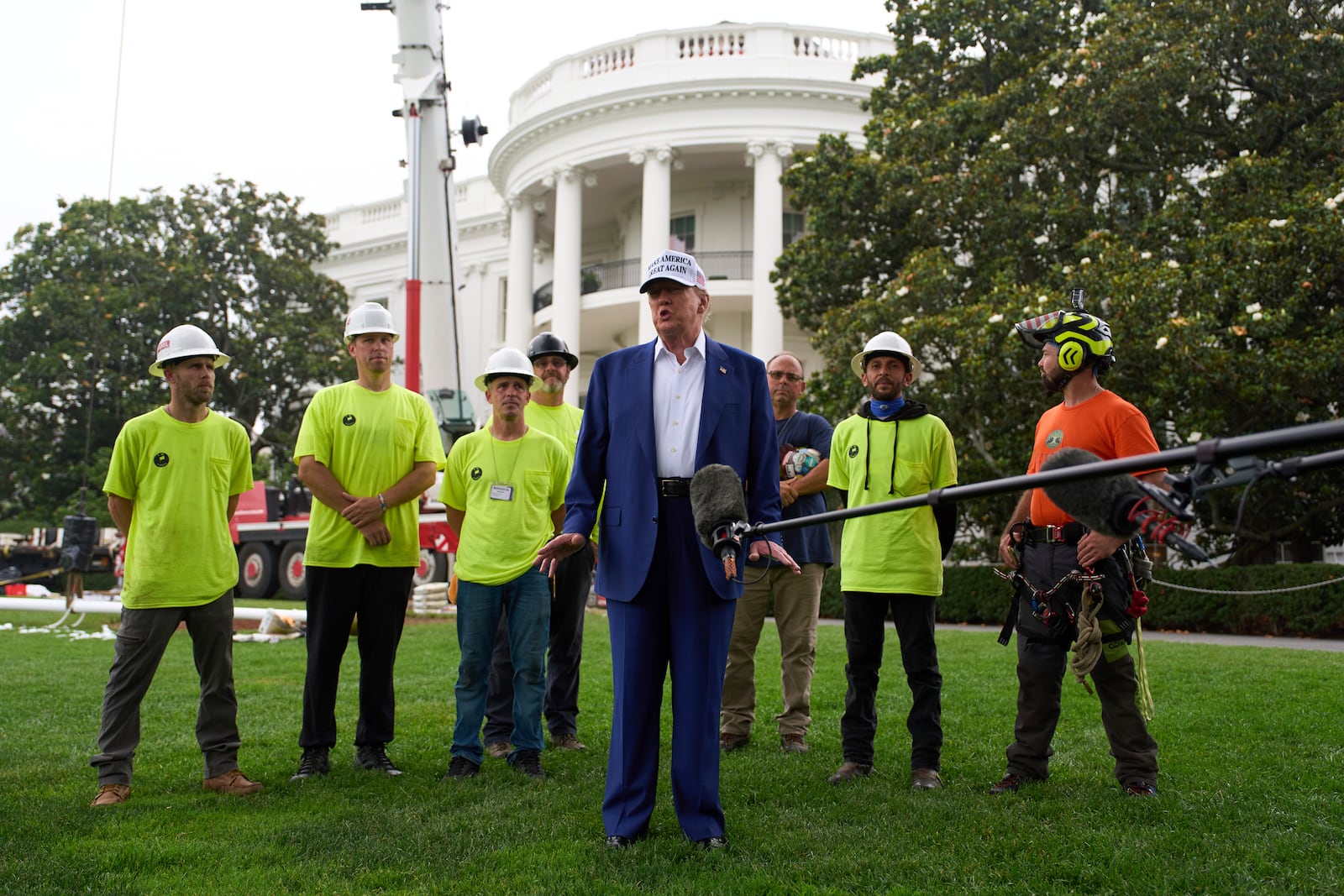President Donald Trump speaks with reporters before a flag pole is installed on the South Lawn of the White House, Wednesday, June 18, 2025, in Washington. (AP Photo/Evan Vucci)