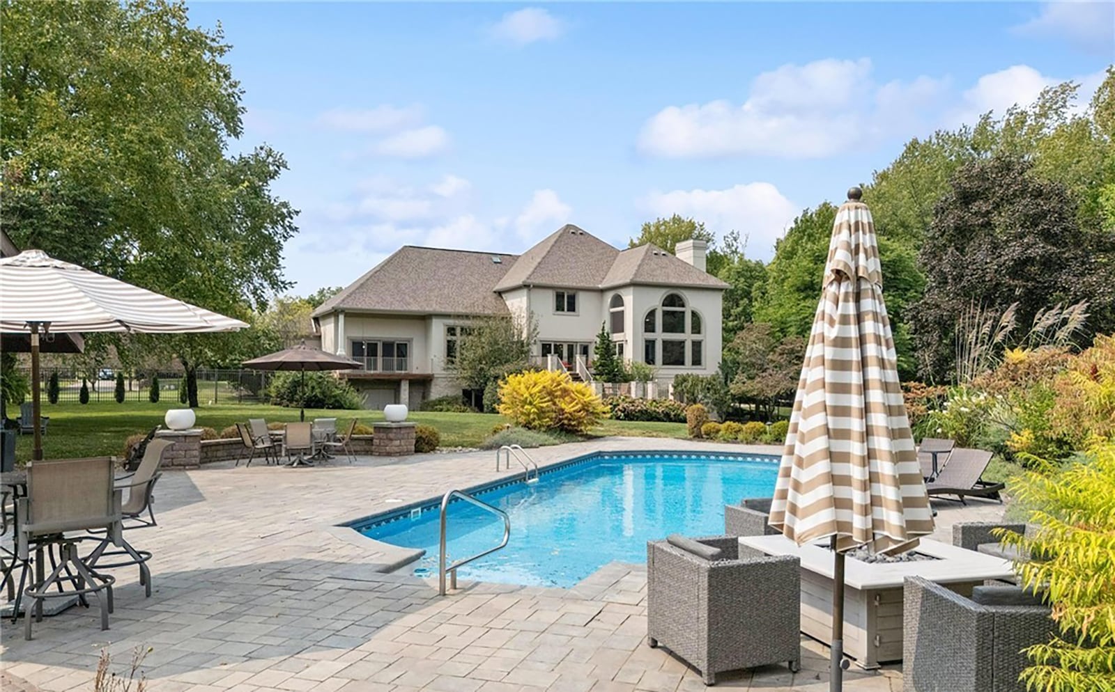 The home has a heated inground pool surrounded by a paver patio. CONTRIBUTED