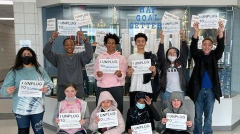 Roosevelt Middle School students created the Unplug Project to participate in the National Day of Unplugging on Saturday and pledged to not use their electronic devices such as cell phones and television for 24 hours to encourage better communications and quality time with their families. Photo by Amber Holdeman