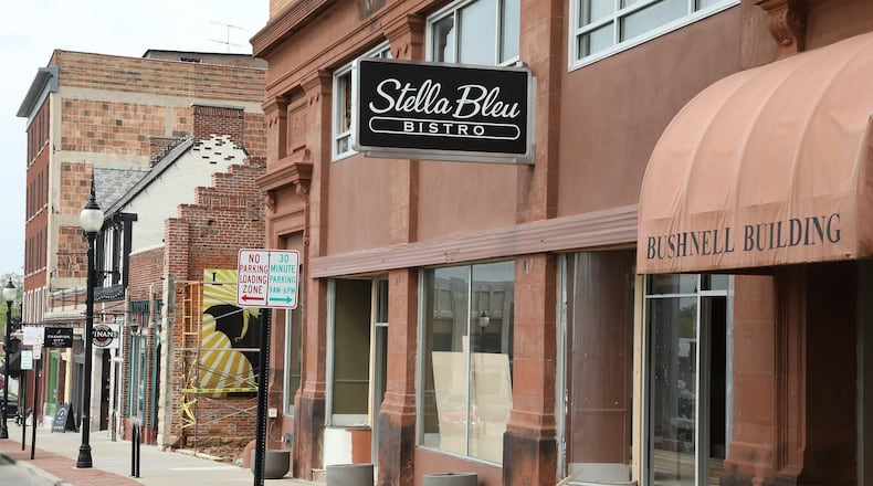 Stella Bleu Bistro, under construction in the Bushnell Building along Fountain Avenue, has put up their new sign. BILL LACKEY/STAFF