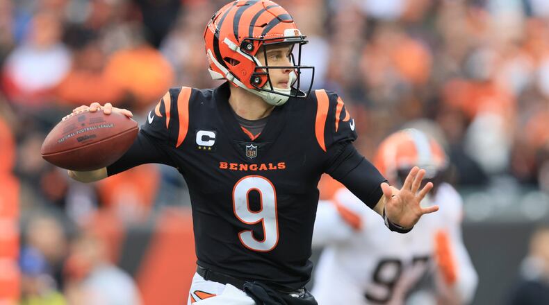 Cincinnati Bengals quarterback Joe Burrow throws during the first half of an NFL football game against the Cleveland Browns, Sunday, Dec. 11, 2022, in Cincinnati. (AP Photo/Aaron Doster)