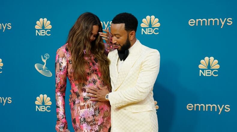 Chrissy Teigen, left, and John Legend arrive at the 74th Primetime Emmy Awards on Monday, Sept. 12, 2022, at the Microsoft Theater in Los Angeles. (AP Photo/Jae C. Hong)