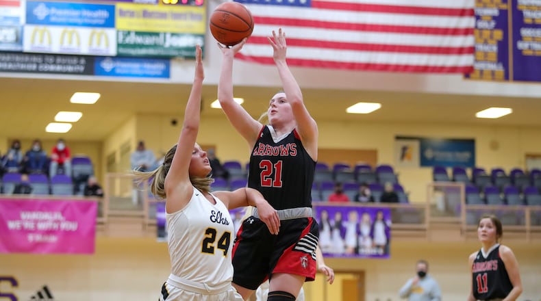 Cutline: Tecumseh High School senior Terah Harness shoots the ball over Centerville's Kendal George during their Division I district semifinal game at the Vandalia Butler Student Activity Center earlier this year. Harness was named the Pam Evans Smith Miss Basketball award winner this season. CONTRIBUTED PHOTO BY MICHAEL COOPER