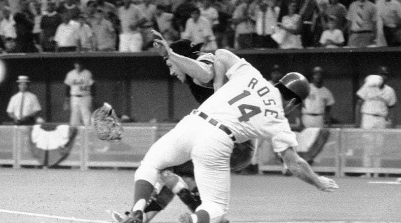 FILE - In this July 14, 1970, file photo, National League's Pete Rose collides with American League catcher Ray Fosse as he scores the winning run during the 12th inning of the baseball All-Star Game in Cincinnati. Fosse, the strong-armed catcher whose career was upended when he was bowled over by Rose, has died. He was 74. Carol Fosse, his wife of 51 years, said in a statement Fosse died Wednesday, Oct. 13, 2021, after a 16-year bout with cancer. (AP Photo/File)