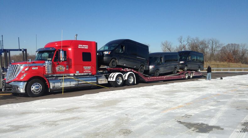Employees of Wheeler Trucking load GM vehicles built at Wheeler Trucking has 18 employees in Springfield but has plans to employ more than 100 workers at its new Springfield terminal./Sumbitted