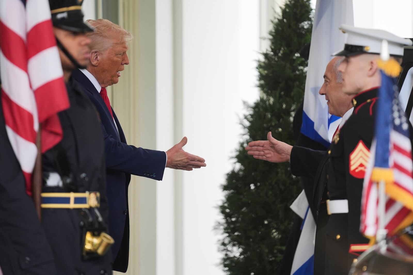 President Donald Trump, left, greets Israel's Prime Minister Benjamin Netanyahu at the White House, Monday, April 7, 2025, in Washington. (AP Photo/Evan Vucci)