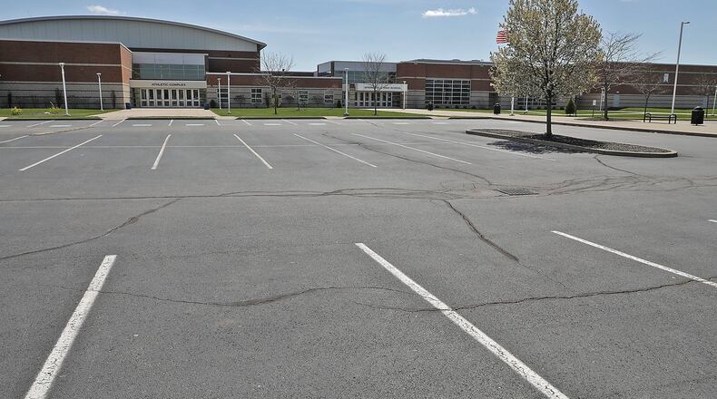 The parking lot at Springfield High School will remain empty for the rest of the school year. BILL LACKEY/STAFF