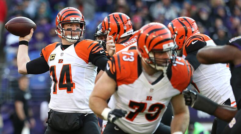 BALTIMORE, MD - NOVEMBER 27: Quarterback Andy Dalton #14 of the Cincinnati Bengals passes the ball while tackle Eric Winston #73 of the Cincinnati Bengals defends against the Baltimore Ravens in the third quarter at M&T Bank Stadium on November 27, 2016 in Baltimore, Maryland. (Photo by Rob Carr/Getty Images)