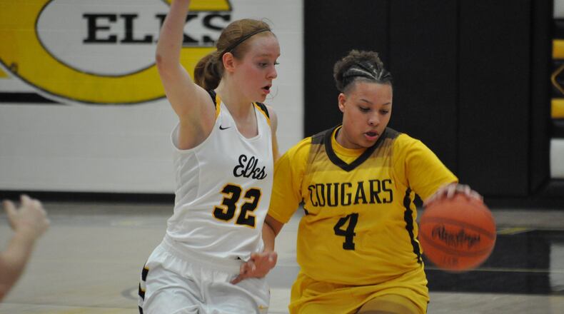 Centerville guard Sam Chable ramps up the defensive pressure on Kenton Ridge’s Desiree Jones during the Elks’ 63-54 victory last week. NICK DUDUKOVICH / CONTRIBUTED