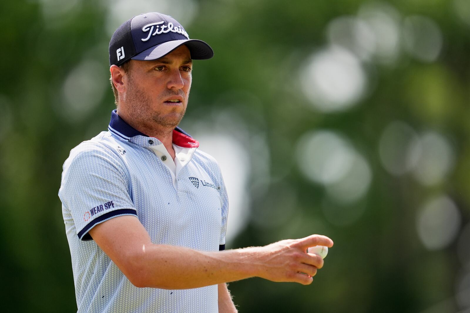 Justin Thomas waves after making a putt on the ninth hole during the first round of the PGA Championship golf tournament at the Quail Hollow Club, Thursday, May 15, 2025, in Charlotte, N.C. (AP Photo/George Walker IV)
