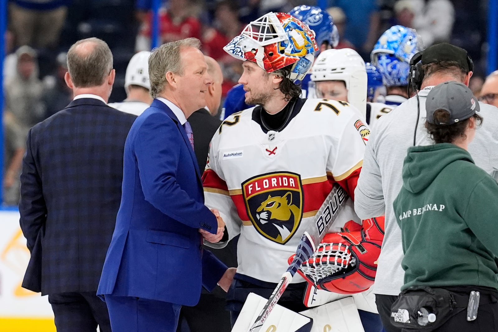 Florida Panthers goaltender Sergei Bobrovsky (72) talks to against the Tampa Bay Lightning head coach Jon Cooper after Game 5 of an NHL hockey Stanley Cup first-round playoff series, Wednesday, April 30, 2025, in Tampa, Fla. (AP Photo/Chris O'Meara)