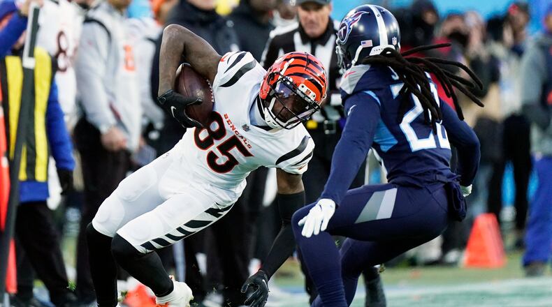 Cincinnati Bengals wide receiver Tee Higgins (85) runs against the Tennessee Titans during the first half of an NFL divisional round playoff football game, Saturday, Jan. 22, 2022, in Nashville, Tenn. (AP Photo/Mark Humphrey)