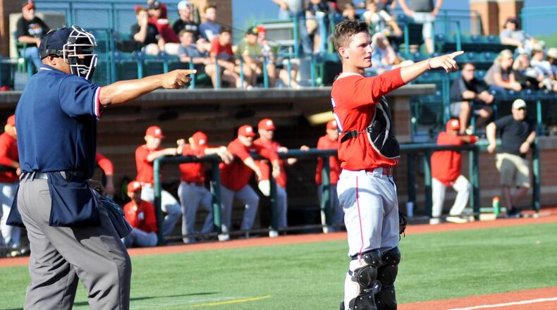 Madison High School catcher Cameron Svarda asks to check a call with the first-base umpire Thursday, May 30, during a Division III regional baseball semifinal against Versailles at Wright State University's Nischwitz Stadium in Fairborn. Versailles won 8-4. RICK CASSANO/STAFF
