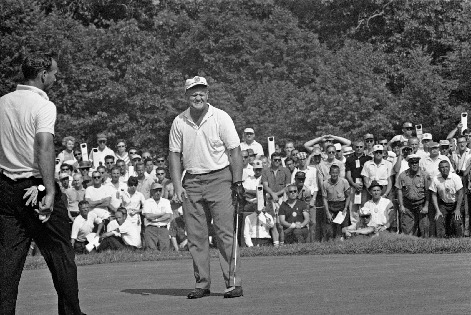FILE - Jack Nicklaus reacts on the first green during the playoff for the National Open Golf Tournament in Oakmont, Penn., June 17, 1962, against Arnold Palmer. (AP Photo/Preston Stroup, file)