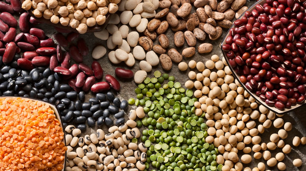 Piles of a variety of healthy organic legumes. ISTOCK