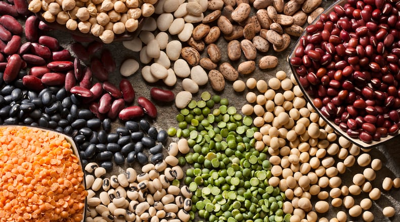 Piles of a variety of healthy organic legumes. ISTOCK