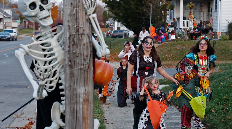 The sidewalks in Springfield were filled with ghouls and goblins with the occasional super hero and princess thrown in for good measure Saturday night, Oct. 29, 2022 during this year's Trick or Treat in Clark County. Kids of all ages went door to door to houses, some with elaborate decorations, filling their bags with sweet treats. BILL LACKEY/STAFF