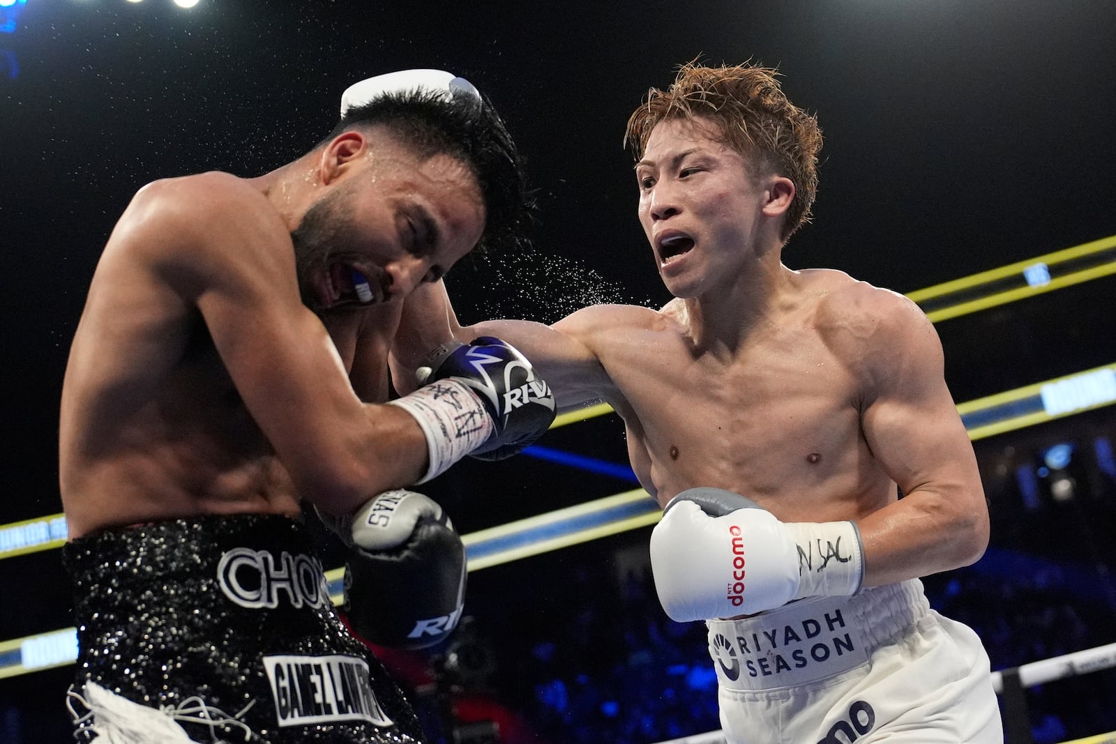 Naoya Inoue hits Ramon Cardenas in a junior featherweight title boxing match Sunday, May 4, 2025, in Las Vegas. (AP Photo/John Locher)