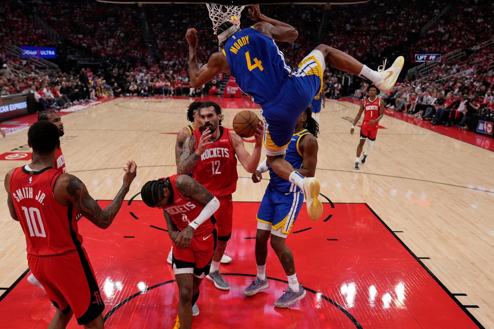 Golden State Warriors guard Moses Moody (4) dunks against the Houston Rockets during the first half of Game 5 of an NBA basketball first-round playoff series, Wednesday, April 30, 2024, in Houston. (AP Photo/David J. Phillip)