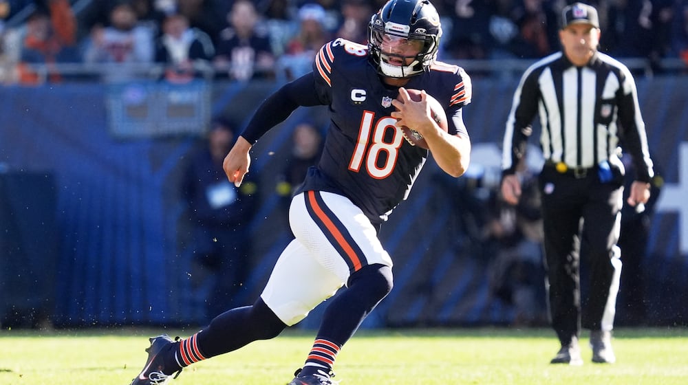 Chicago Bears quarterback Caleb Williams (18) carries the ball during the first half of an NFL football game against the Pittsburgh Steelers, Sunday, Nov. 23, 2025, in Chicago. (AP Photo/Nam Huh)