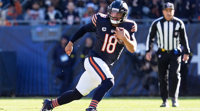 Chicago Bears quarterback Caleb Williams (18) carries the ball during the first half of an NFL football game against the Pittsburgh Steelers, Sunday, Nov. 23, 2025, in Chicago. (AP Photo/Nam Huh)