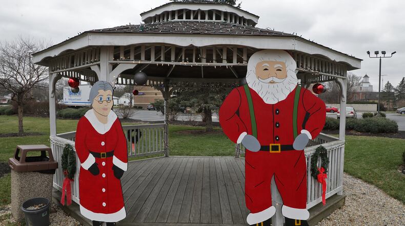 A class at Greenon High School has made holiday cutouts for the Village of Enon. The cutouts have been placed in parks and public areas around the village. BILL LACKEY/STAFF