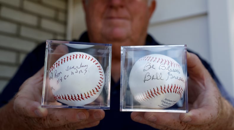 John Leep, organizer of Stevie's World of Wiffle Ball, holds two baseballs that were autographed by Negro League baseball players Ron Teasley and Bill Greason. The ball will be auctioned at the annual Wiffle Ball Tournament. BILL LACKEY/STAFF