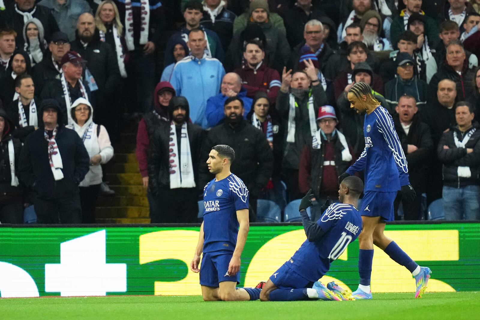 PSG's Achraf Hakimi, centre, celebrates after scoring his side's opening goal during the Champions League quarterfinal second leg soccer match between Aston Villa and Paris Saint-Germain at Villa Park stadium, Birmingham, England, Tuesday, April 15, 2025. (AP Photo/Kirsty Wigglesworth)