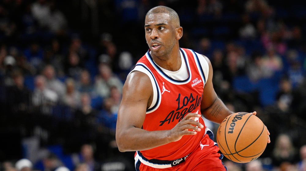 FILE - Los Angeles Clippers guard Chris Paul drives to the basket during the second half of an NBA basketball game against the Orlando Magic, Thursday, Nov. 20, 2025, in Orlando, Fla. (AP Photo/Phelan M. Ebenhack, File)